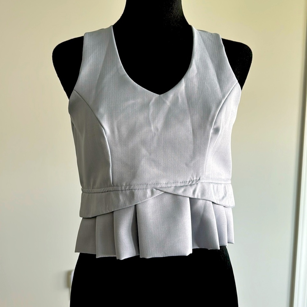 Light blue/light grey crop shirt.